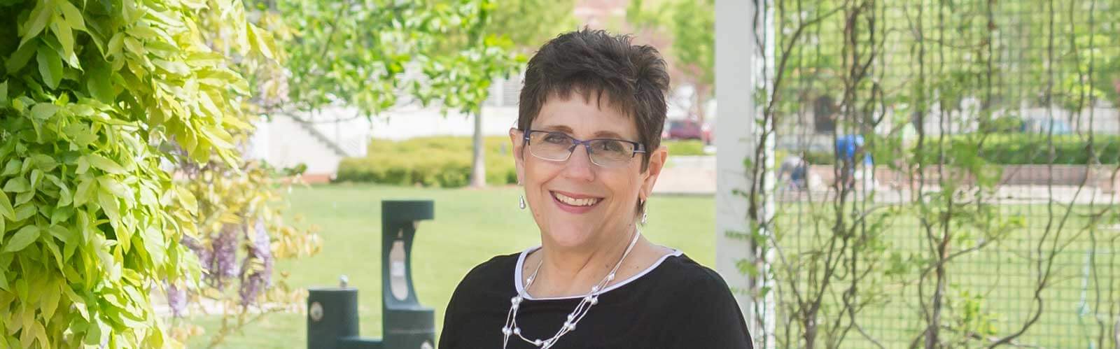 Photo of Deb Olejownik outside office